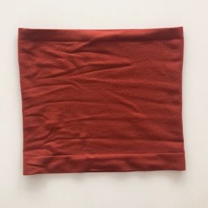 Out from under burnt orange tube top